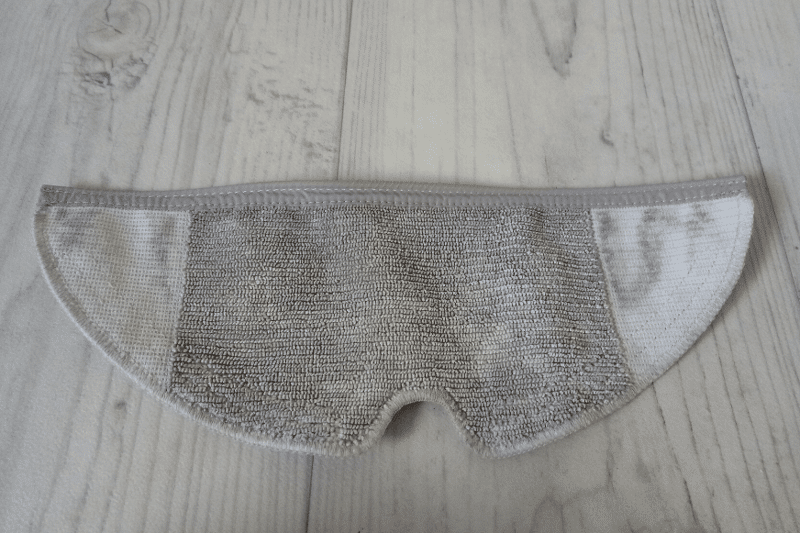 The dirty mop cloth lies on the floor